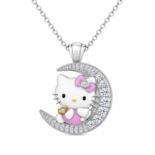 A sterling silver pendant necklace featuring Hello Kitty sitting on a crescent moon. The pendant is decorated with white enamel, a pink bow, a pink dress, and sparkling clear crystals.