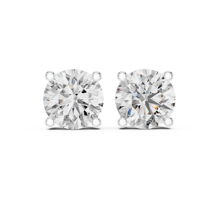 Pair of diamond stud earrings on a white background
