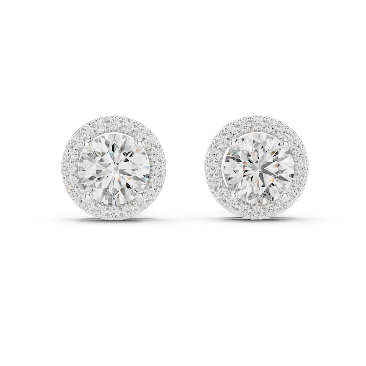 A pair of round halo stud earrings with brilliant-cut center stones surrounded by a halo of smaller stones, set in a silver-toned metal on a white background.